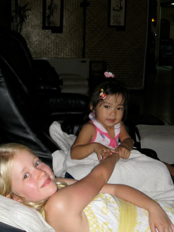 Estelle gets massage from a very young masseuse