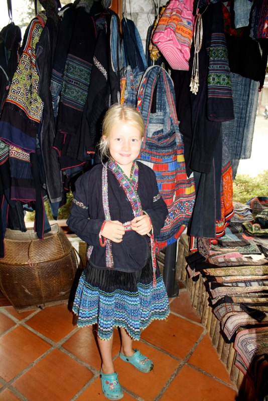 Estelle getting dress in traditional clothes